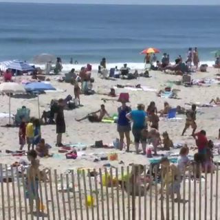 Beachgoers face sand, surf, social distancing