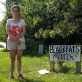 Raccoon nailed near Black Lives Matter sign