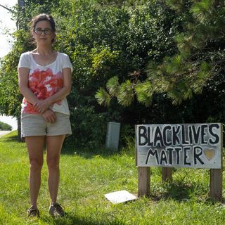 Raccoon nailed near Black Lives Matter sign