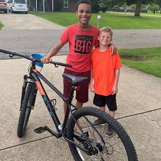 Young boy wins bike, gives neighbor the new wheels