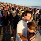 Hundreds gather in Huntington Beach to be baptized with cold dunk in the ocean