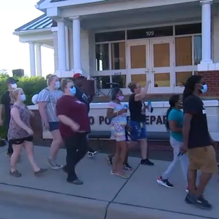 Dozens march for justice after man killed in Roxboro officer-involved shooting