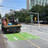 Houston mulls changing weird green parking spots into bike lanes