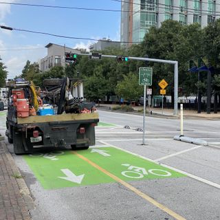 Houston mulls changing weird green parking spots into bike lanes