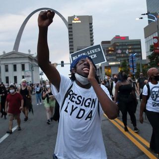 Protesters march downtown to oppose federal anti-crime initiative