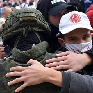 Belarus riot police drop shields and are embraced by anti-government protesters | CNN