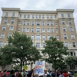 Protesters Gather Outside Of Postmaster General’s D.C. Home As Threats To Mail-In Voting Loom