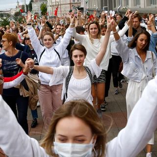 Women in white become faces of Belarus protests as thousands are arrested after disputed election