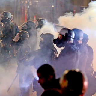 Portland police declare riot, use smoke to clear crowd