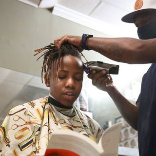 Kids get a haircut and a reading lesson at this St. Pete barbershop