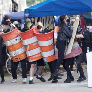 On day of planned encampment clearing, city officials meet with organizers and a lawsuit puts the evictions on hold