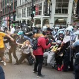 Accusations fly between police and protesters one day after violent clash injured dozens