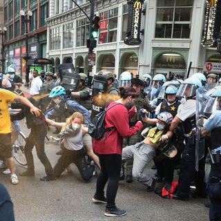 Accusations fly between police and protesters one day after violent clash injured dozens