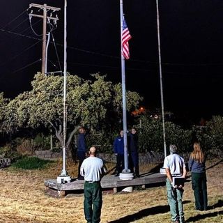 New York firefighters assisting in Oregon hold flag raising ceremony to honor 9/11 victims