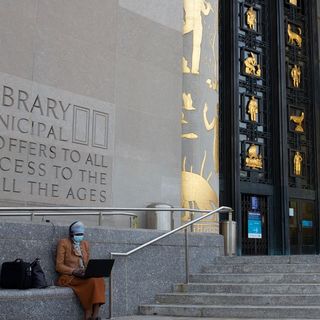 WiFi Sign of the Times as New Yorkers Gather Outside Libraries for Free Internet