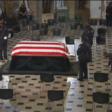 Justice Ruth Bader Ginsburg's trainer does push-ups in front of her coffin at the Capitol