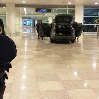 Car smashes through airport as two men 'shout Islamist slogans'