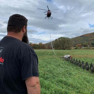 Helicopter With Hanging Saws Trims Trees Along Vt. Train Tracks