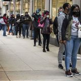 Chicagoans line up, at a distance, on first day of early voting