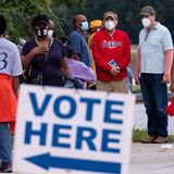 Heavy turnout and glitches mark start of early voting in Georgia