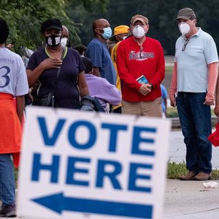 Heavy turnout and glitches mark start of early voting in Georgia