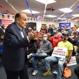 Giuliani campaigns for Trump in a packed Philly office space, with fans in ‘Save Columbus’ masks