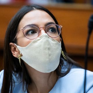 AOC, House progressives warn Biden on corporate hires