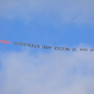 Airplane banner warns of the potential superspreader event prior to Trump’s rally