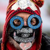 Peace protesters form human chain outside German parliament - ThinkPol