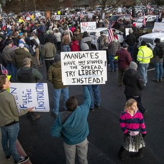 The Latest: Tensions rise over masks as virus grips smaller U.S. cities