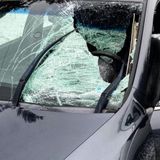 Driver gets glass lodged in eye when snow and ice from truck crashes through his windshield