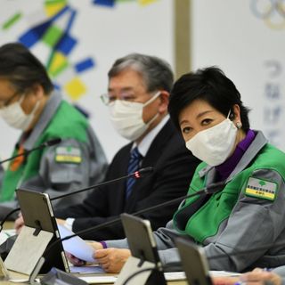 Tokyo records 822 coronavirus cases and raises alarm as hospitals 'clogged'