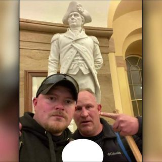 Photo surfaces showing two Rocky Mount police officers inside Capitol on Wednesday