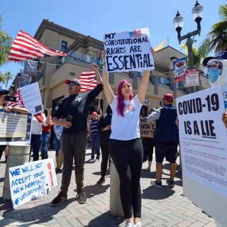 Scores gather in Huntington Beach to protest coronavirus stay-at-home orders