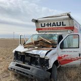 Man faces multiple charges after eluding police in U-Haul truck, driving through house