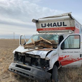 Man faces multiple charges after eluding police in U-Haul truck, driving through house