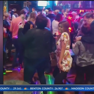 Large group seen dancing, maskless, at Bentonville bar