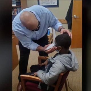 A middle schooler was insecure about his haircut. So his principal fixed it himself instead of disciplining the boy for wearing a hat | CNN