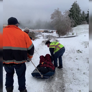 Video shows plow driver and crew using old sled to rescue COVID-19 patient trapped by snow