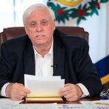 WVa governor agrees to live in government seat, ending case