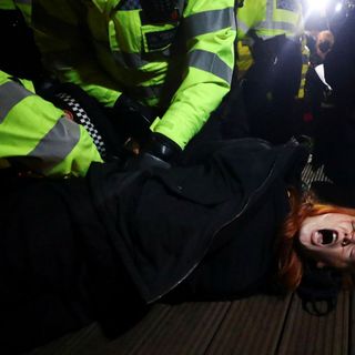 U.K. police face backlash after dragging mourners from vigil for murdered woman Sarah Everard