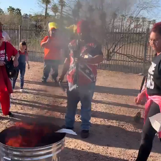 Protesters hold "mask burning rally" outside Maricopa County Public Health