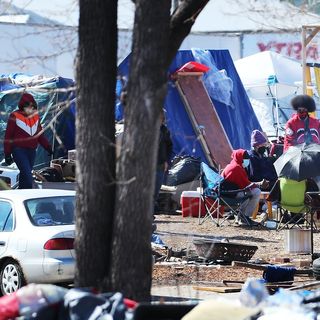 City's attempt to clear Minneapolis homeless camp leads to scuffles between police, camp defenders