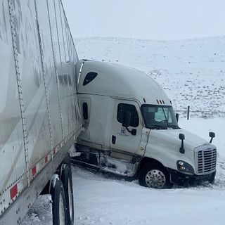 PHOTOS: 'Near-Miss!' When Semi Nearly Jackknives Into WYDOT Plow