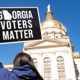 Georgia governor signs law curbing voting access