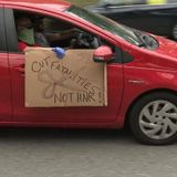 Protesters drive by Governor's mansion to show disapproval of Governor Kemp's decision to reopen businesses