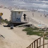 Tens of thousands swarm California beaches despite governor's stay-at-home orders