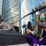 Climate activists shatter 19 windows at HSBC HQ in London’s Canary Wharf