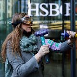 Extinction Rebellion protesters smash HSBC bank windows in protest