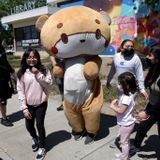 Bearsun, the life-size teddy bear, strolls through San Jose
